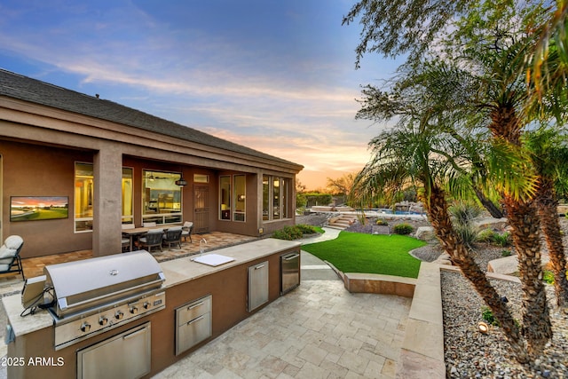 view of patio with outdoor dining space and area for grilling