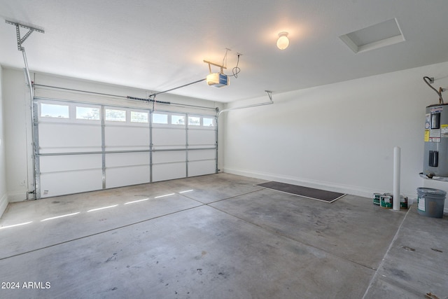 garage featuring electric water heater and a garage door opener