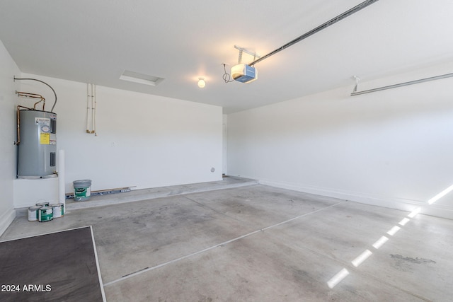 garage with water heater and a garage door opener