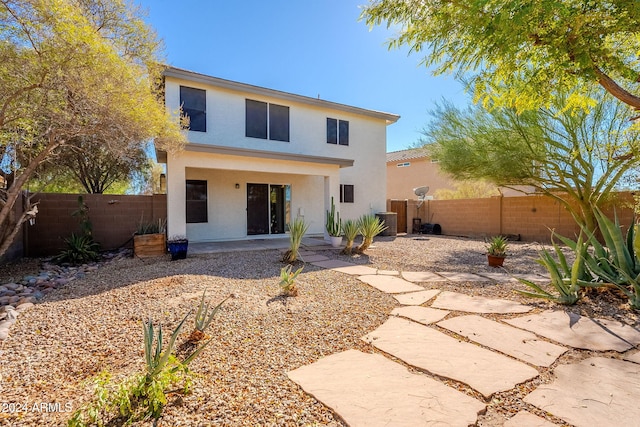 back of property with a patio area