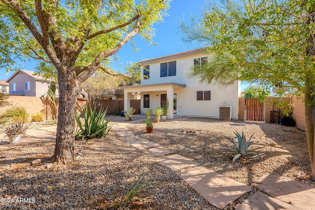 rear view of property featuring a patio area