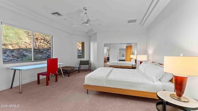 bedroom with ceiling fan, ornamental molding, and carpet flooring