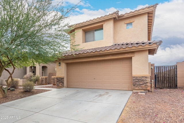 6528 S 258th Dr, Buckeye, AZ 85326 - mediterranean / spanish home with an attached garage, stone siding, a tile roof, concrete driveway, and stucco siding