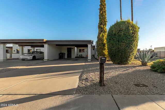 view of front facade with a carport