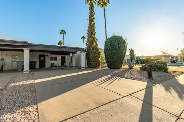 view of front of home with a carport