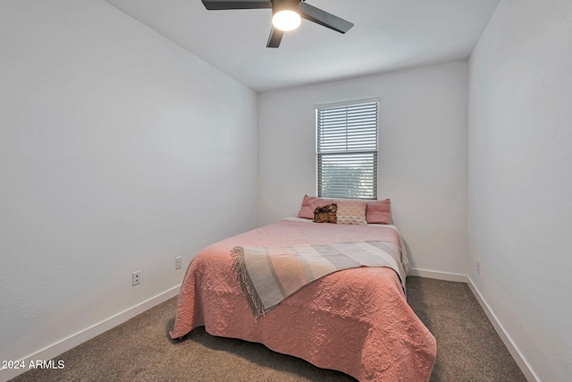 bedroom with a ceiling fan, carpet, and baseboards