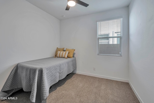 bedroom featuring a ceiling fan, carpet flooring, and baseboards