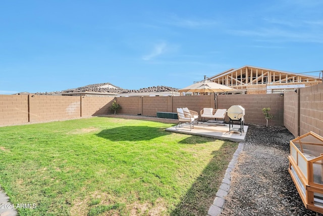 view of yard featuring a patio area and a fenced backyard