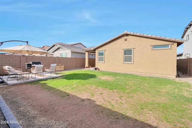 view of yard with a patio area and a fenced backyard