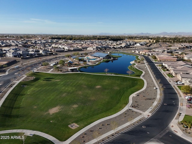 drone / aerial view featuring a water view and a residential view