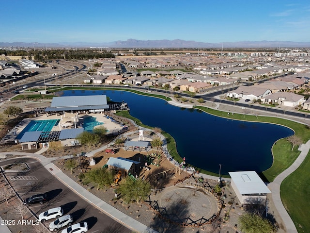 birds eye view of property with a water and mountain view and a residential view