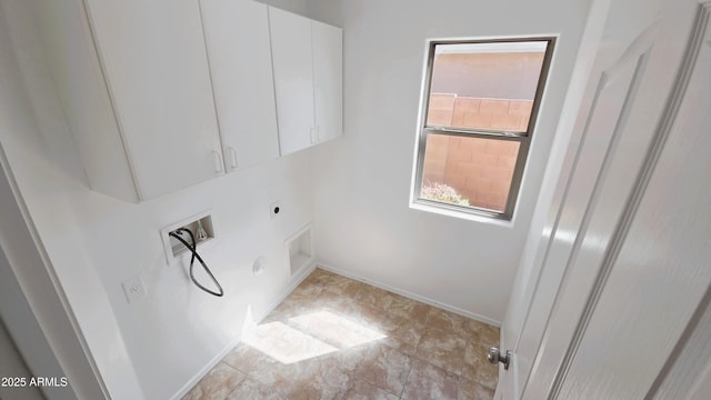 washroom featuring baseboards, washer hookup, cabinet space, and electric dryer hookup