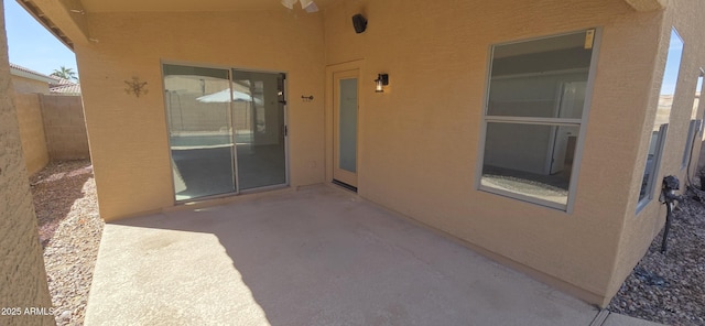 view of patio featuring fence