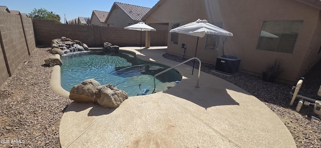 view of swimming pool with a fenced backyard, a fenced in pool, and a patio