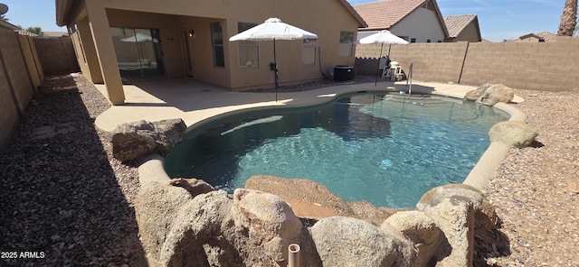 view of pool featuring a patio, a fenced in pool, and a fenced backyard