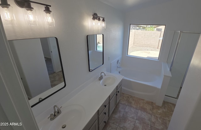full bathroom with a bath, double vanity, a sink, and vaulted ceiling