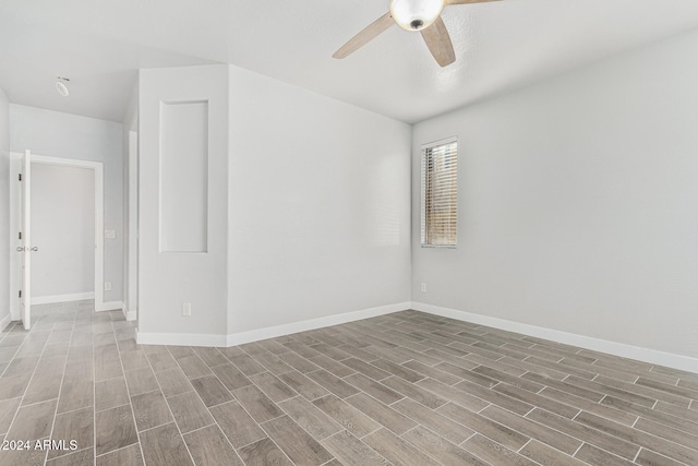 unfurnished room with wood-type flooring and ceiling fan