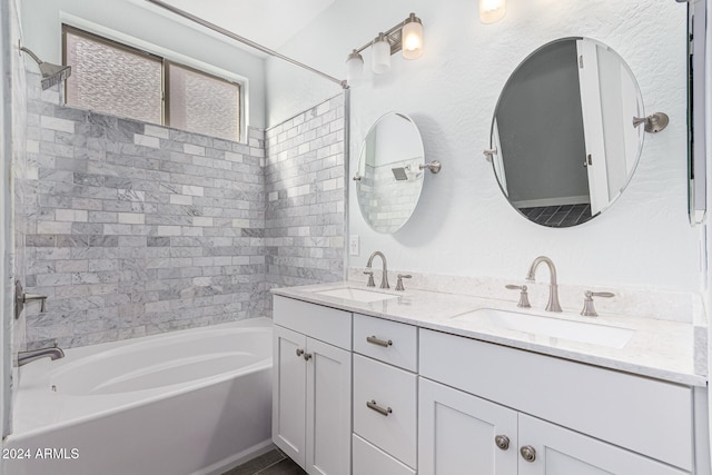 bathroom with vanity and tiled shower / bath