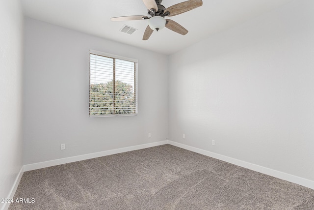 spare room with carpet flooring and ceiling fan