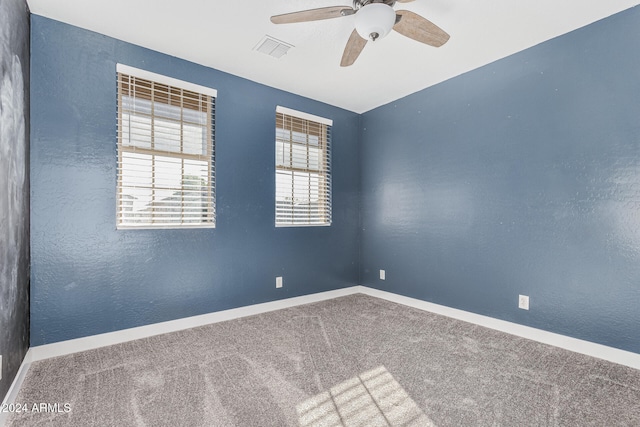 carpeted empty room with ceiling fan