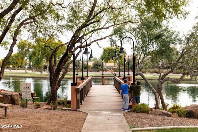 surrounding community with a water view