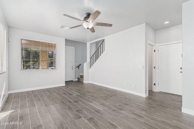 unfurnished room with ceiling fan and hardwood / wood-style floors