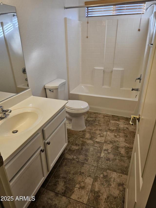 full bathroom featuring shower / bath combination, vanity, and toilet