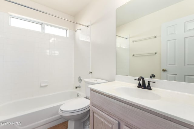 full bathroom featuring toilet, vanity, and  shower combination