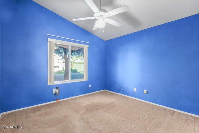 unfurnished room featuring vaulted ceiling, ceiling fan, and carpet floors