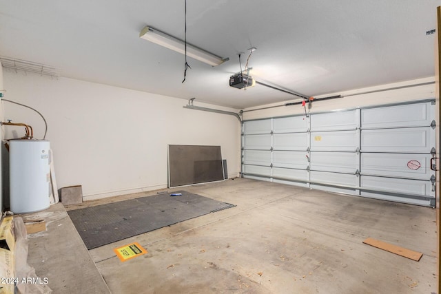 garage with water heater and a garage door opener