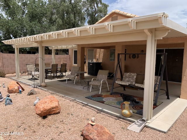 rear view of property featuring a patio area