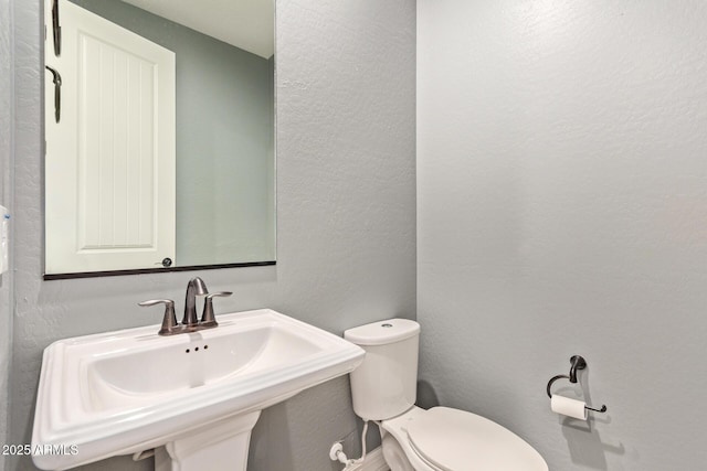 bathroom with sink and toilet