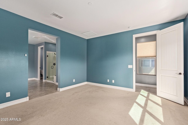 unfurnished bedroom with light colored carpet