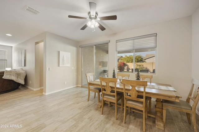 dining area featuring light hardwood / wood-style flooring and ceiling fan