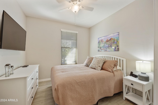 bedroom featuring light hardwood / wood-style flooring and ceiling fan