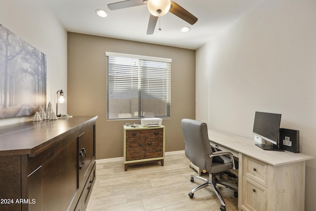 home office featuring ceiling fan and light hardwood / wood-style flooring