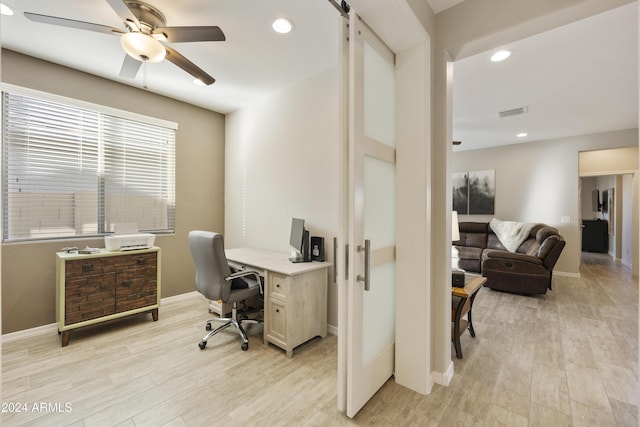 office space featuring ceiling fan and light hardwood / wood-style floors