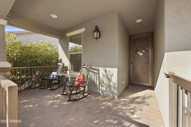 doorway to property featuring a porch