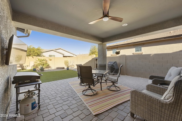 view of patio / terrace featuring a grill and ceiling fan