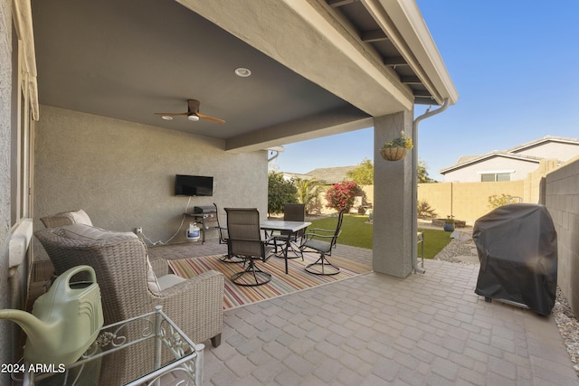 view of patio / terrace with area for grilling and ceiling fan