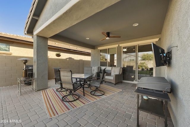 view of patio / terrace with grilling area, ceiling fan, and an outdoor living space