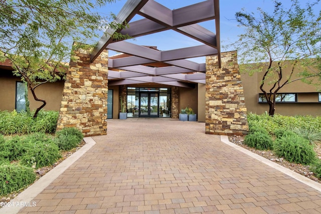 property entrance featuring french doors