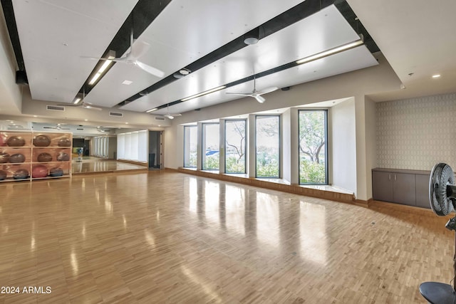 workout area with ceiling fan and hardwood / wood-style flooring