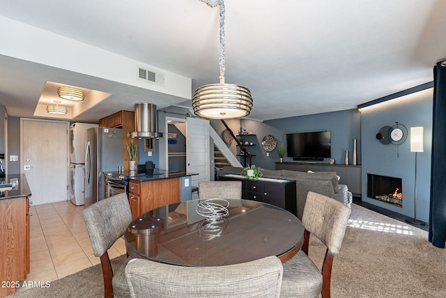 dining room featuring light tile patterned flooring