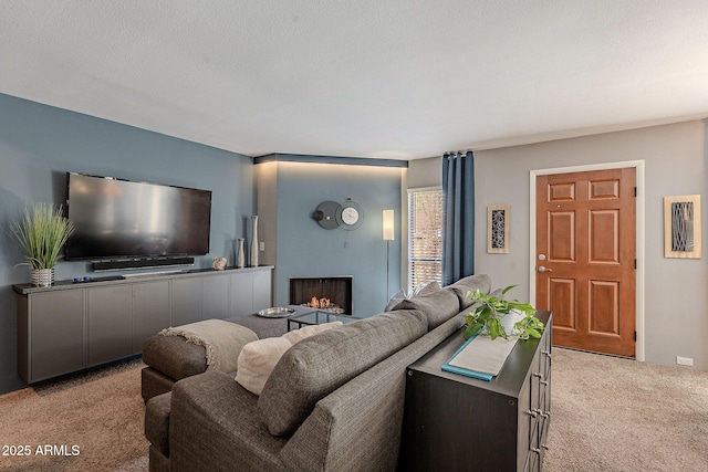 living room with light colored carpet and a textured ceiling