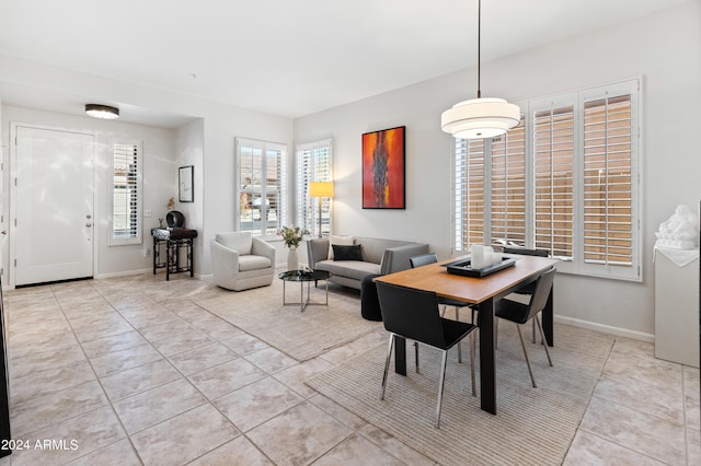 dining area featuring light tile patterned floors