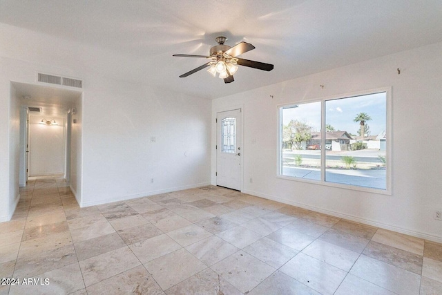 unfurnished room featuring ceiling fan