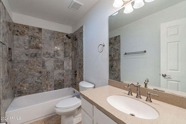 full bathroom featuring tile patterned floors, toilet, vanity, and tiled shower / bath