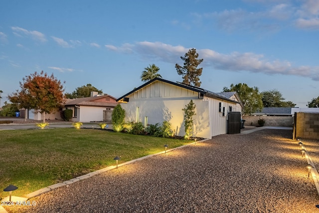 view of side of home featuring a yard