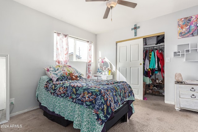 bedroom with carpet, ceiling fan, and a closet